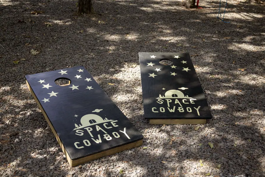 Space Cowboy branded cornhole boards