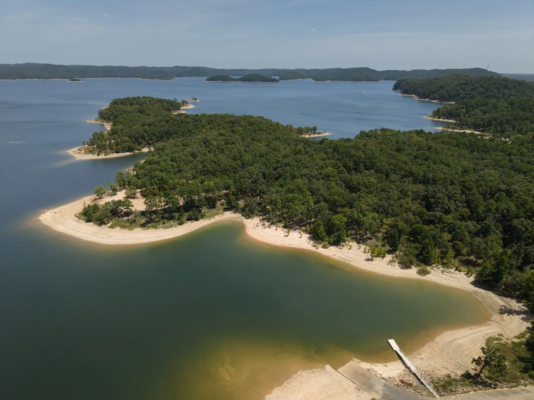 Aerial view of Broken Bow Lake's sandy points and clear water